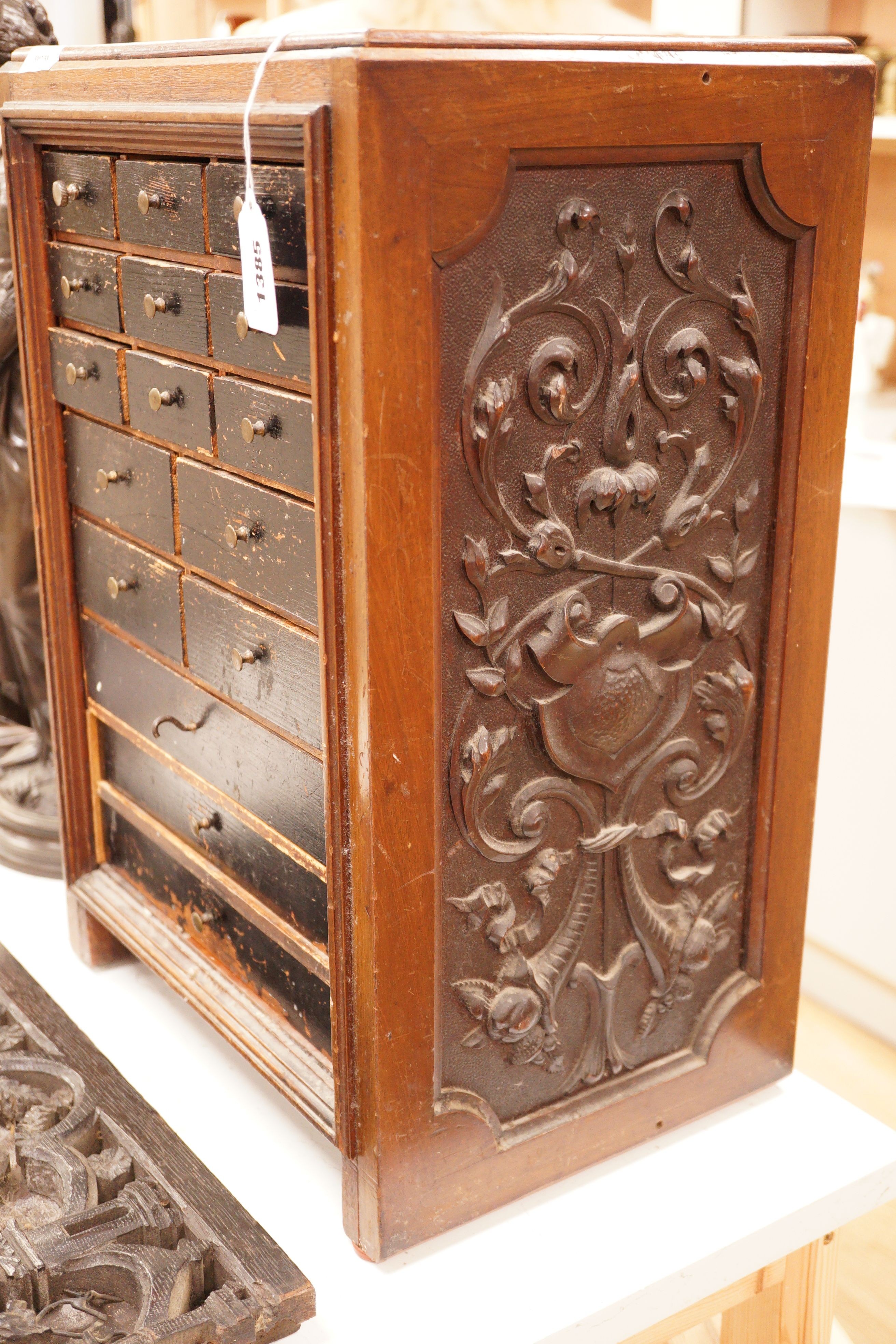 A Continental collector's miniature bank of drawers, 54cm tall